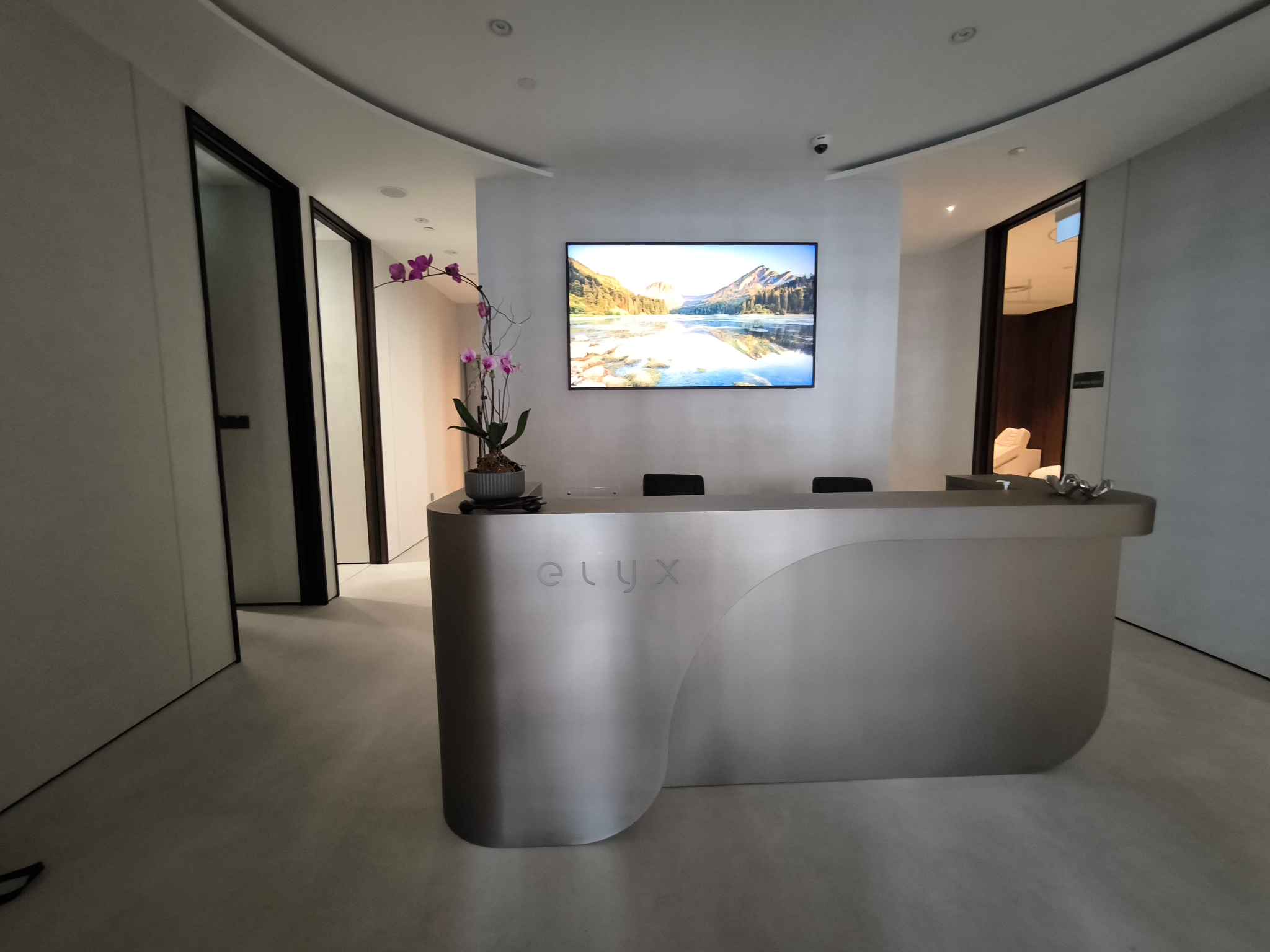 Elyx Life clinic interior and team at the Raffles Hotel Arcade, Singapore