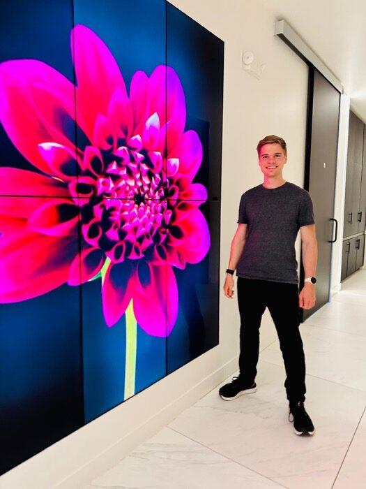 Elio Verhoef beside a video wall at Human Longevity's South San Francisco clinic